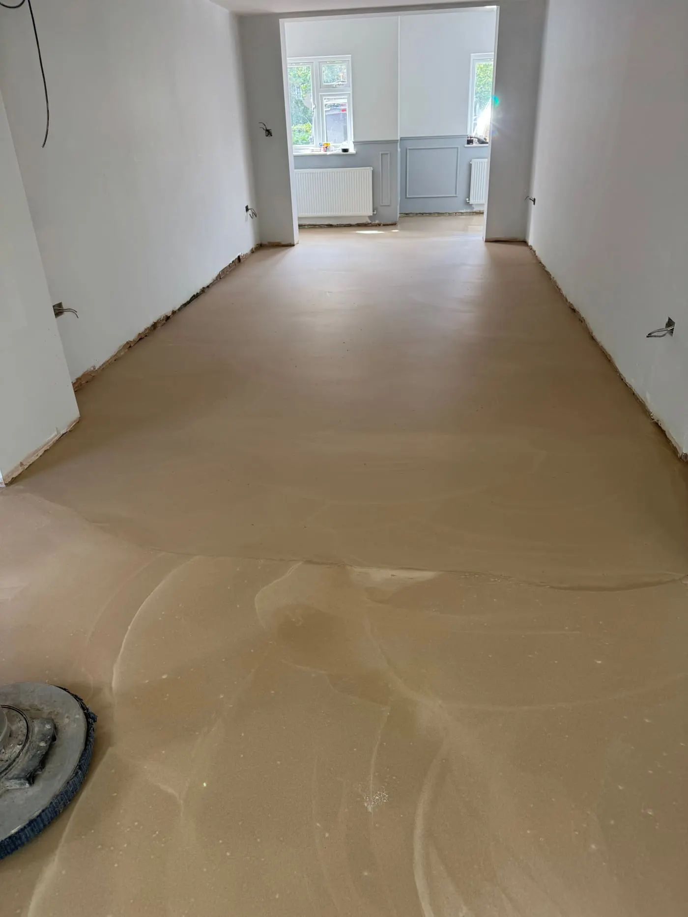 Fresh screed and subfloor levelling before flooring installation